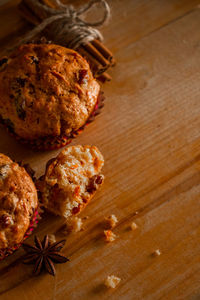 Delicious homemade muffins with raisins. christmas baking on a wooden background.