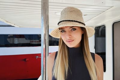 Portrait of young woman in train