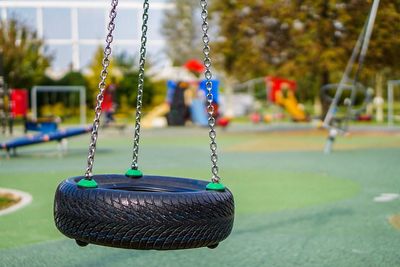 Close-up of swing in playground