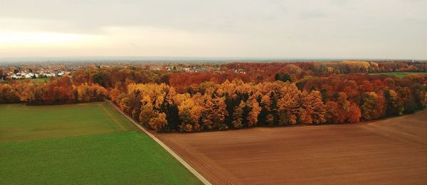 Scenic view of landscape against sky during autumn