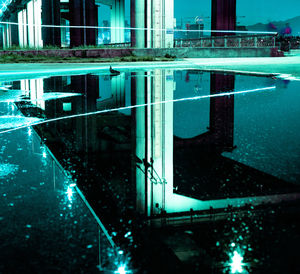 Reflection of building in puddle