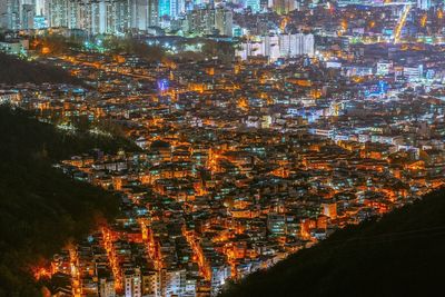 High angle view of illuminated cityscape at night