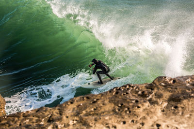 High angle view of man surfing in sea