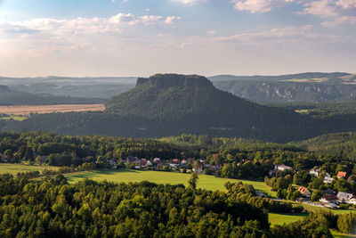 Scenic view of landscape and mountains against sky