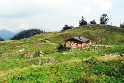 House on field against sky