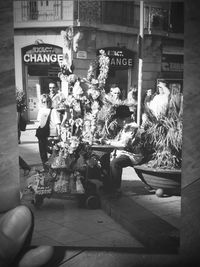 Man sitting in front of building