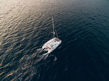 High angle view of sailboat sailing in sea