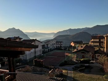 Houses in town against clear sky