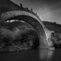 Arch bridge against sky