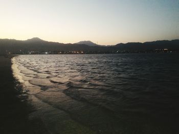 Scenic view of sea against sky at sunset