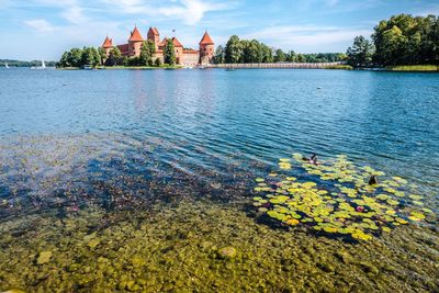 Scenic view of lake galve by trakai castle against sky