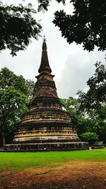 View of old temple building against sky