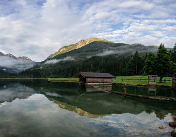 Scenic view of lake and mountains against sky