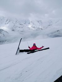 Person skiing on snowcapped mountain