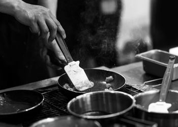 Person preparing food in kitchen