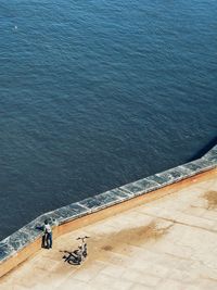 High angle view of man looking at sea