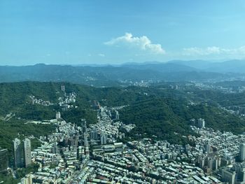 High angle view of buildings in city against sky