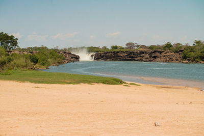 Scenic view of beach against clear sky