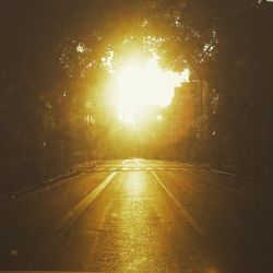 Sun shining over road