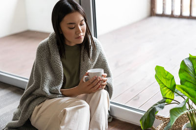 Young woman using mobile phone