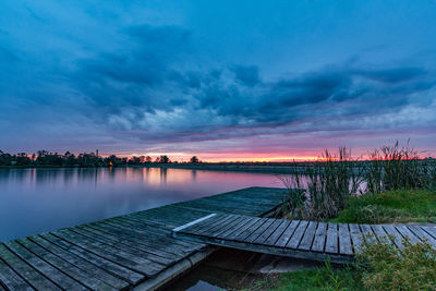 Scenic view of lake against sky during sunset