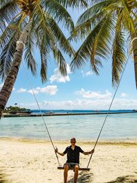 Full length of man on beach against sky