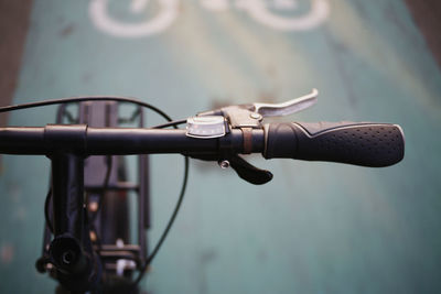 Close-up of bicycle parked on street