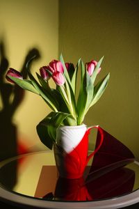 Close-up of red rose in vase