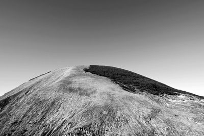 Low angle view of sand against sky