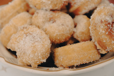 Full frame shot of sugar donuts on plate