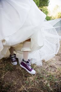 Low section of person standing on field