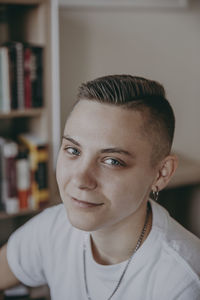 Portrait of young man at home