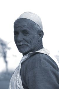 Portrait of smiling mid adult man against sky