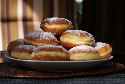 Close-up of donuts in plate on table