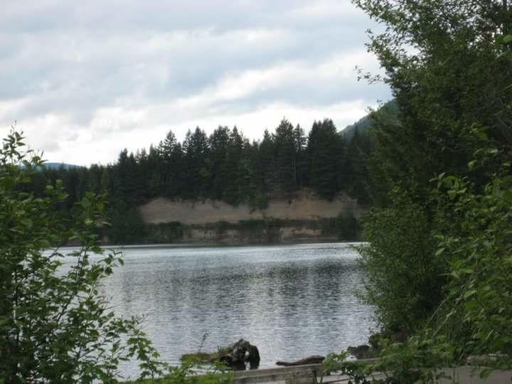 SCENIC VIEW OF RIVER AGAINST CLOUDY SKY