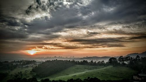 Scenic view of landscape against cloudy sky