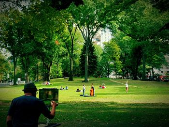 People relaxing in park