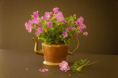 Close-up of pink flower pot on table