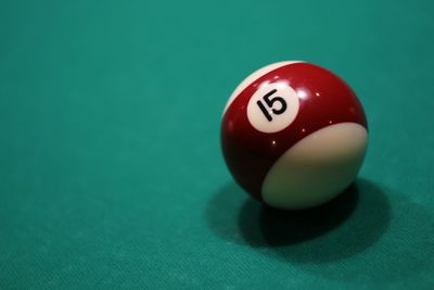 Close-up of pool ball on pool table