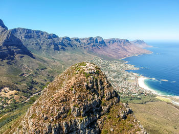 Drone view - summit of lion's head and camps bay with twelve apostles in cape town, south africa.