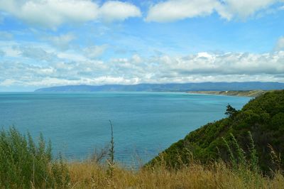 Scenic view of sea against cloudy sky