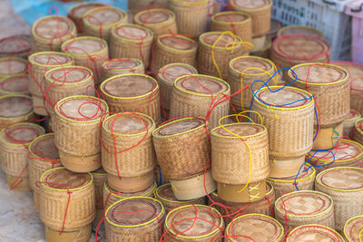 High angle view of wicker containers for sale at market stall