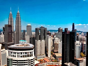 Modern buildings in city against sky