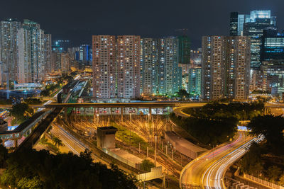 High angle view of illuminated city buildings at night