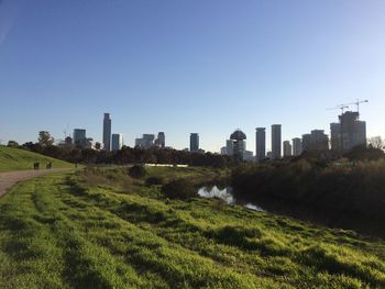 Panoramic shot of city buildings against clear sky