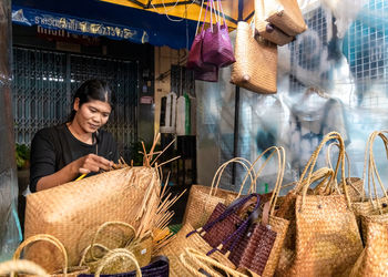 Woman working in basket at market