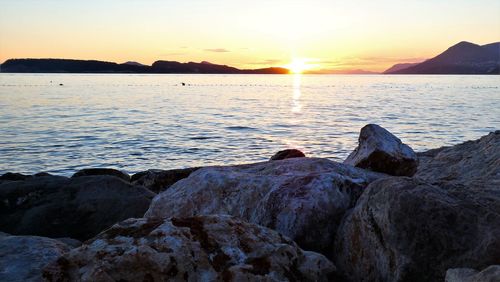 Scenic view of sea against sky during sunset