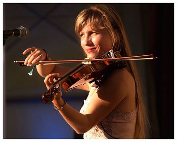 Beautiful young woman playing guitar