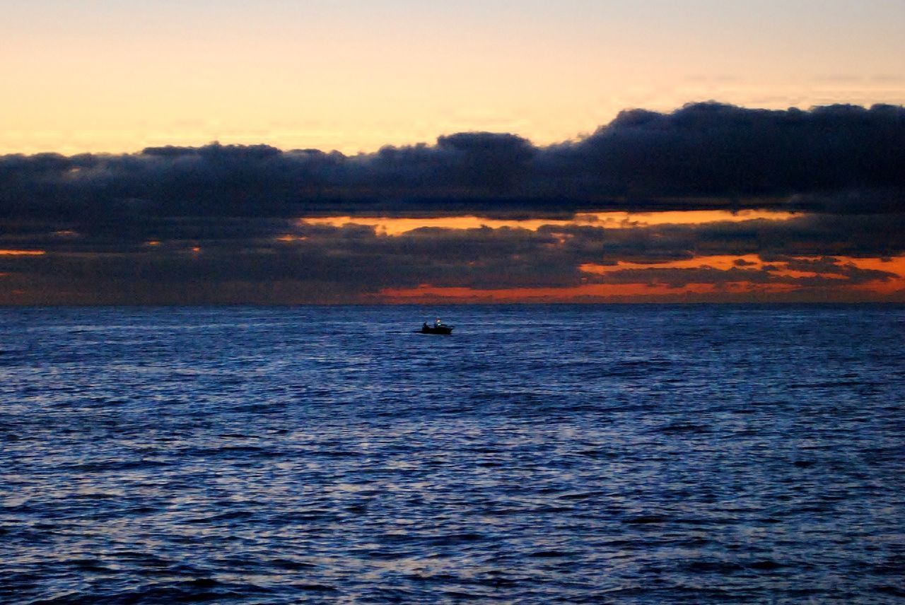 SCENIC VIEW OF SEA DURING SUNSET