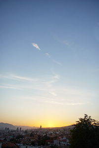 High angle view of buildings against sky at sunset